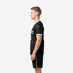 Right side view of custom jet black soccer uniform set with sublimated team name and white contrast trim on collar and cuffs