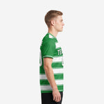 Custom green soccer jersey left side view showing full horizontal stripe sublimation print from shoulder to hem on adult male model