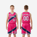 Back view of custom kids basketball uniform in hot pink and navy showing back player name and number placement on the jersey