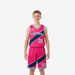 Custom kids basketball uniforms in hot pink and navy with diagonal stripe pattern, full set front and back view showing team name and number placement