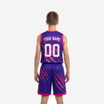 Back view of purple and pink junior basketball uniforms showing back name and number placement and matching claw-slash shorts design