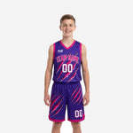 Custom kids basketball uniforms in purple and pink with claw-slash sublimation print, team name arched across chest, front number 00, matching shorts - front view