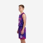 Right side view of youth basketball jersey and shorts set in purple and pink showing diagonal slash pattern across shorts legs and drawcord waistband