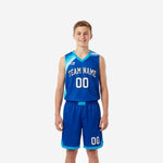 Custom kids basketball uniforms in royal blue and cyan showing front and back of the full two-piece sublimated set with arced team name and player numbers