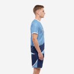 Custom light blue soccer uniform side view showing gradient panel transition from sky blue to navy blue on jersey and shorts