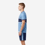 Custom light blue soccer uniform right side view showing navy shorts with powder-blue and white side stripe panel