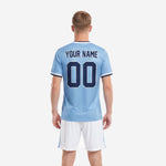 Front detail of custom light blue soccer jersey with arched team name and navy number
