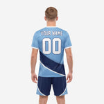 Custom light blue soccer jersey with diagonal navy colorblock panel and white crew neck trim, close detail