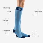 Navy blue triple-stripe cuff band detail on custom light blue soccer socks for club matchday teamwear