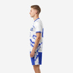 Custom light blue soccer uniform White base Royal Blue marble print, right side view with shorts detail