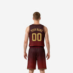 Opposite side view of maroon and gold sublimated basketball jersey and shorts showing pinstripe pattern and armhole binding detail