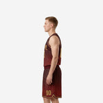 Side view of custom maroon and gold pinstripe basketball uniform showing crew neckline binding and shorts waistband profile