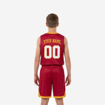 Opposite side view of maroon boys basketball uniforms with gold armhole binding and elastic waistband accent strip