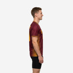 Custom Maroon mens soccer training jersey showing Athletic Gold diagonal stripe side panel detail, left side view