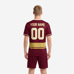 Custom maroon and Athletic Gold soccer kit jersey detail showing arched team name and front number sublimation print