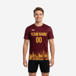 Custom maroon and athletic gold soccer practice jersey with gradient treeline print, front view on male model