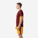 Custom maroon soccer uniform right side view showing full-dye sublimation print on maroon jersey with Athletic Gold cuff trim and shorts colorblocking