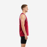 Custom maroon basketball jersey showing white V-neck trim, arched team name across chest, and bold front number on male model