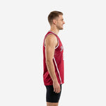 Full front view of custom maroon basketball jersey with crimson halftone dot pattern, white V-neck binding, arced team name, and number 00 on male model