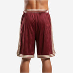 Back view of custom maroon basketball shorts showing diamond-jacquard maroon fabric and cream hem stripe finish