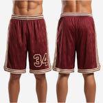 Close detail of custom maroon basketball shorts hem showing double cream stripe and maroon V-point side split trim