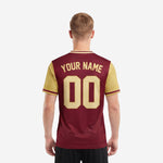 Custom red and black soccer jersey back angle showing full sublimation maroon body with Vegas Gold sleeve panels