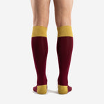 Close-up of Athletic Gold ribbed fold-over cuff on custom maroon soccer socks