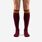 Custom maroon soccer socks youth with Athletic Gold triple-stripe cuff band, front view