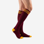 Custom maroon gold soccer socks side view showing knee high length and mesh calf panel