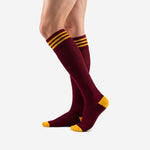 Maroon soccer socks for matches with Athletic Gold toe cap and ribbed elastic cuff, side angle