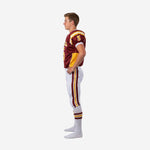 Left side view of custom sublimated youth tackle football uniform showing set-in sleeve fit, gold shoulder panel white accent stripe, and full-length pants side stripe