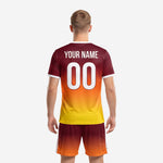 Custom maroon and orange gradient soccer kit front detail showing arched team name and front number print zones on full-dye sublimated jersey