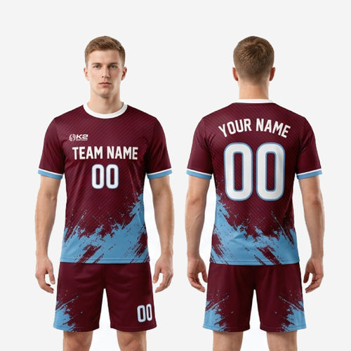 Full custom maroon matchday soccer kit showing complete jersey and shorts set with sky blue and white trim