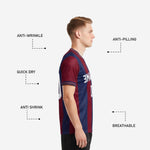 Close detail of custom maroon navy blue men's soccer team jerseys showing coral and white contrast cuff trim stitching