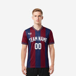 Custom maroon and navy blue men's soccer team jerseys with vertical stripe pattern and white arched team name on front