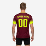 Close detail of neon yellow gradient sleeve on custom maroon soccer training jersey showing dot-burst fade into maroon body