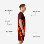Custom maroon soccer uniform shorts side panel showing matching orange lightning-bolt graphic and elastic waistband