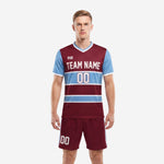 Custom maroon and sky blue men's soccer team uniforms front view showing stripe jersey and matching shorts