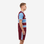 Men's custom maroon soccer team uniform left side view displaying sky blue sleeve and side stripe shorts