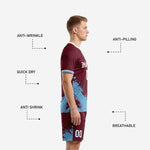 Maroon soccer shorts with sky blue splash print and white player number, close-up detail view