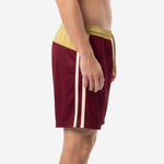 Maroon soccer shorts with twin ivory side stripes and diagonal Vegas Gold hip panel, left side view