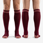 Custom maroon soccer socks full-length side profile showing knee-high reach and athletic knit construction