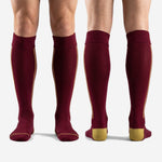 Detail of Athletic Gold heel accent on custom maroon soccer socks showing reinforced double-knit construction