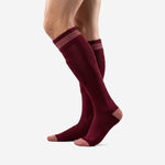 Custom maroon soccer socks showing reinforced heel and rose-pink toe, right side profile