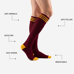 Custom maroon soccer socks showing Athletic Gold contrast toe cap and heel block detail