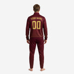 Maroon soccer tracksuit jacket detail showing Athletic Gold chest logo placement and full-length zip front on adult male model