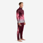 Custom maroon soccer tracksuit side view showing continuous galaxy gradient from shoulder to Silver Grey ribbed cuffs and tapered sublimated pants