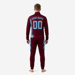 Full-zip stand collar jacket in maroon with sky blue splash sublimation print and player number on chest