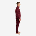 Custom maroon soccer tracksuit 2-piece set, left side profile showing tapered pants and ribbed ankle cuffs, mens athletic cut