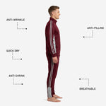 Custom maroon soccer tracksuit pants detail showing silver-grey side panel and tapered ankle with zip cuff
